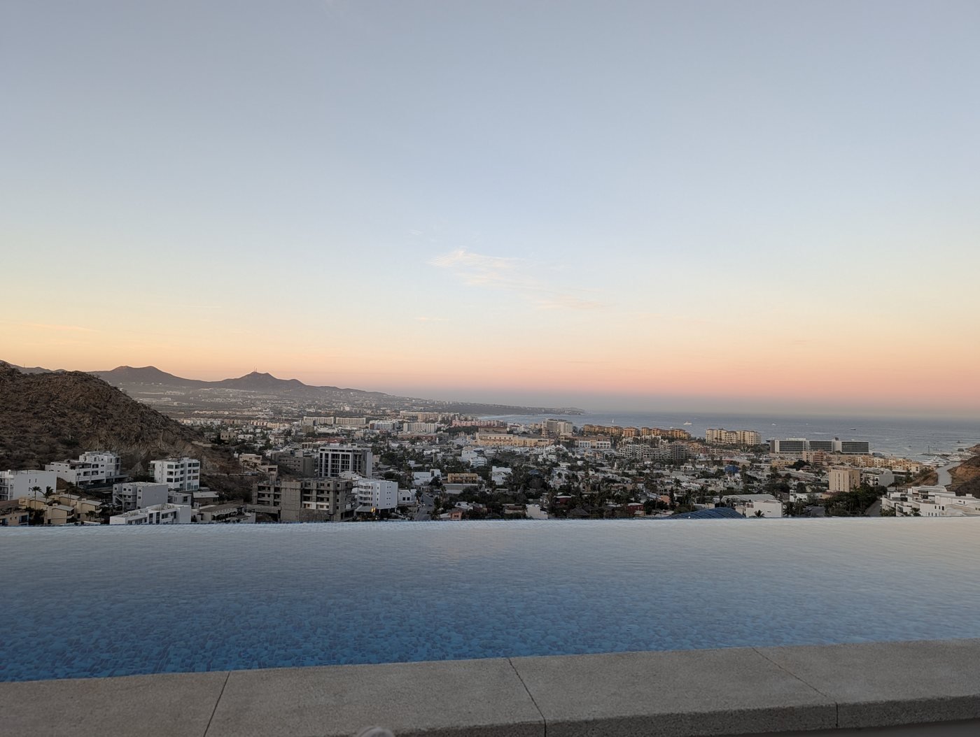 Sunset over Cabo San Lucas from an infinity pool